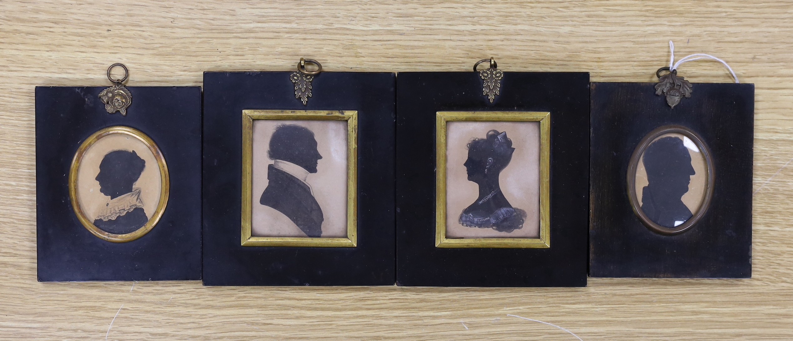 Four Victorian painted and cut paper silhouettes of Colonel John Campbell and other members of his family